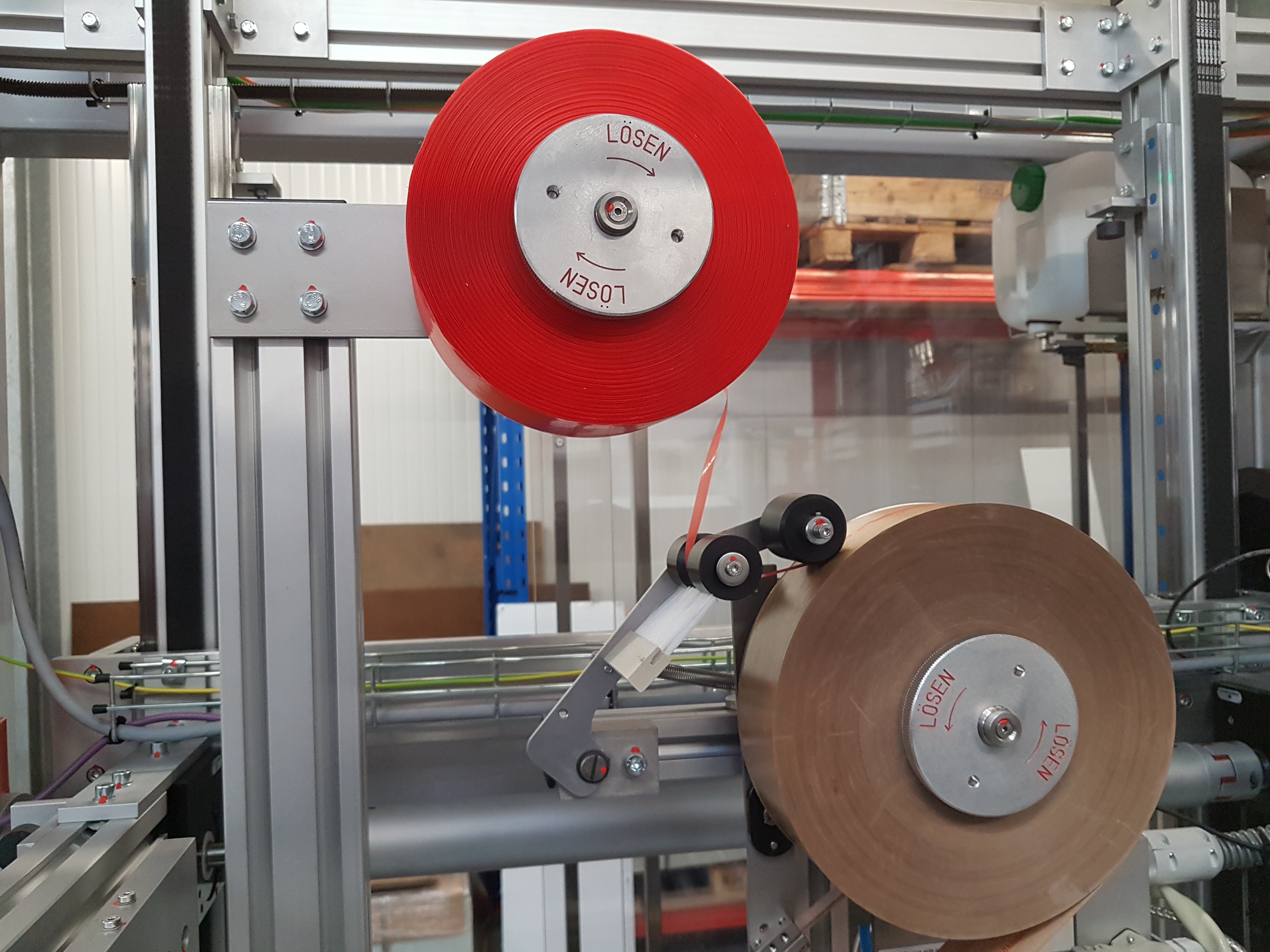 Gummed tape and Knife-free opening strip reels Raupack UK and Ireland